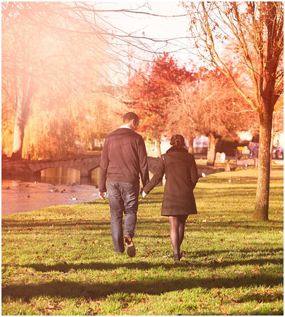 Photo of bride and groom walking during sunset by Cotswolds Wedding Photographer Annabel Farley Photography