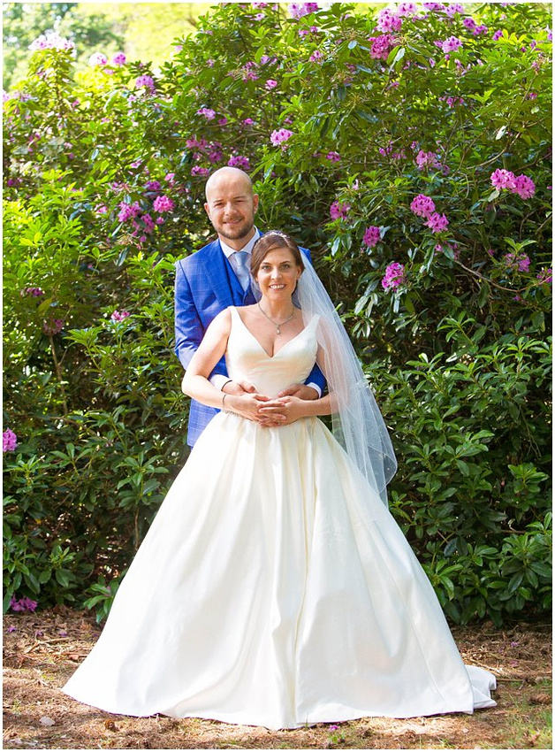 portrait of newlyweds at the gardens at tylney hall in basingstoke, hampshire