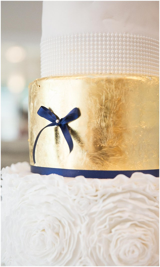 wedding cake with navy and gold details