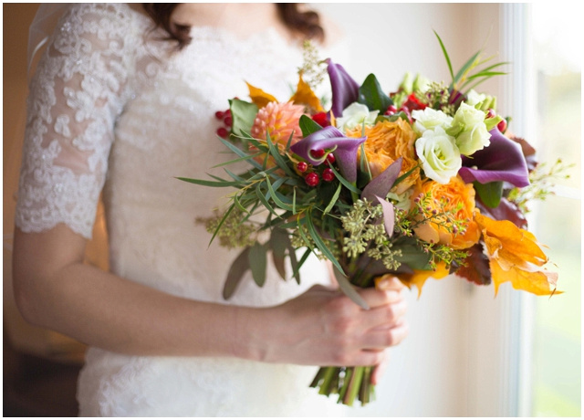 bride holding floral bouquet for a summer wedding at Hyde Barn