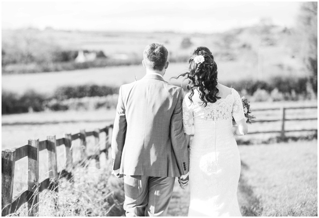 romantic black and white formal portrait of bride and groom at Hyde Barn in the Cotswolds