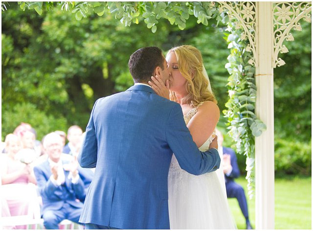 bride and groom's first kiss on wedding day