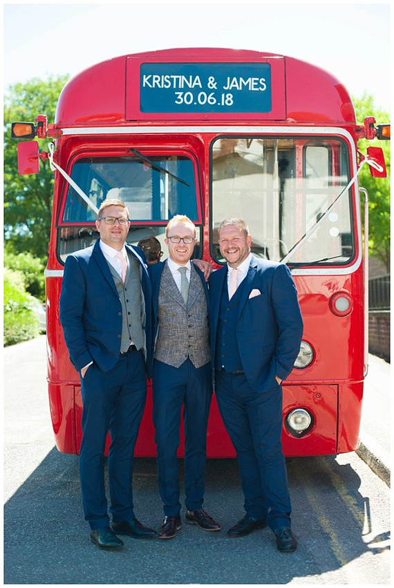 photo of groomsmen and red trolley