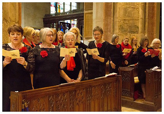 guests singing at wedding ceremony at St. Mary the Virgin Fairford