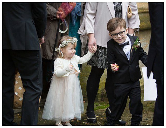 candid photo at wedding ceremony at St. Mary the Virgin Fairford