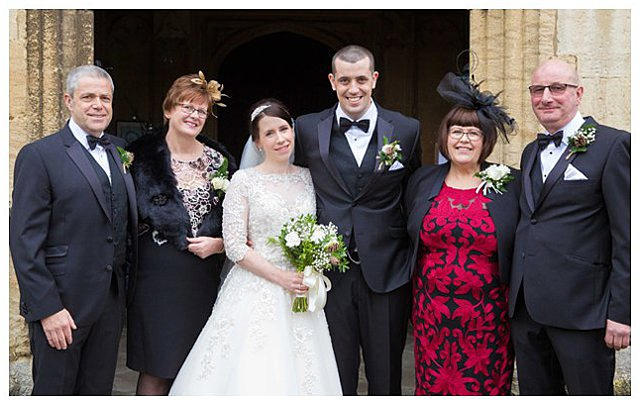 formal family portrait at wedding ceremony at St. Mary the Virgin Fairford