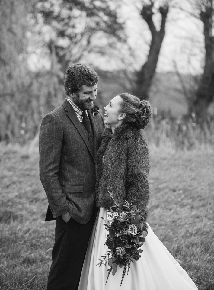 bride and groom laughing