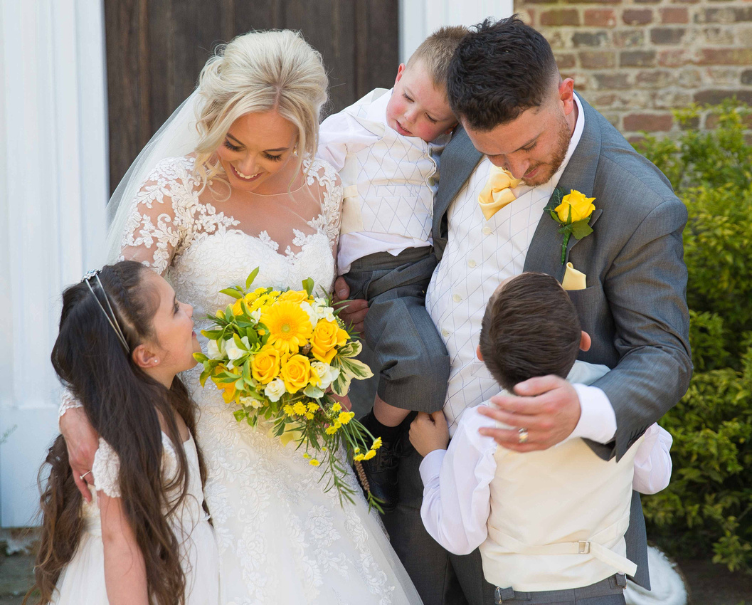 wedding couple with their children